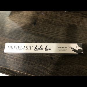 Brand new sealed “Lashie Liner” clear.